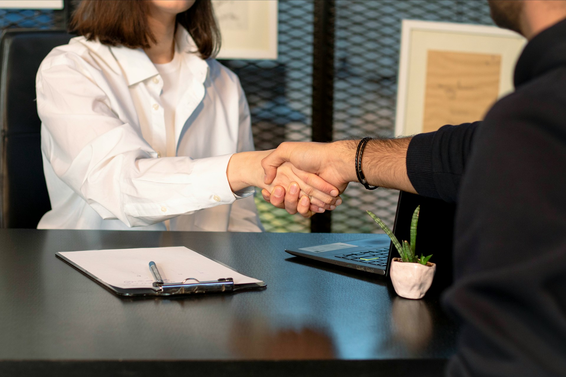A man and woman shaking hands